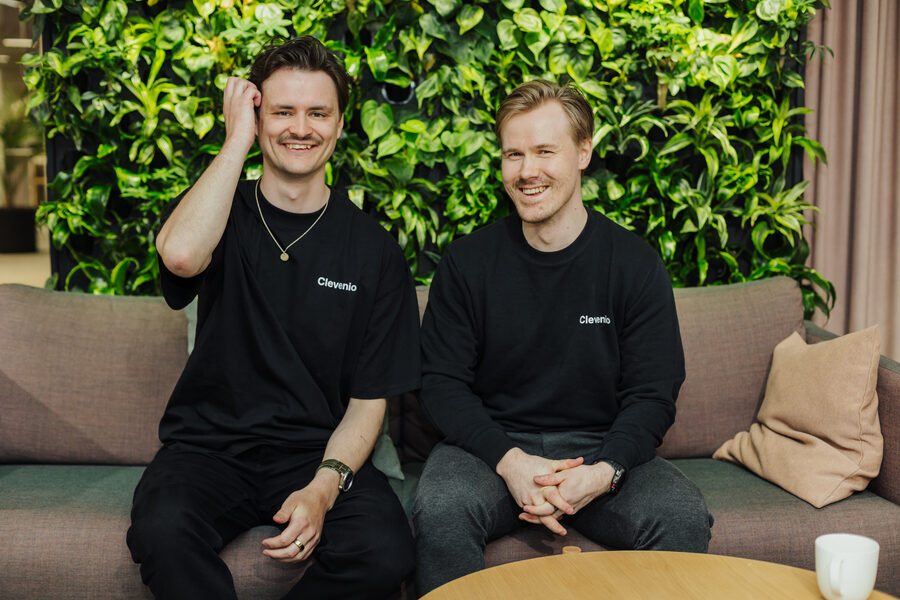Aki Hokkanen laughing with a colleague at the Clevenio office